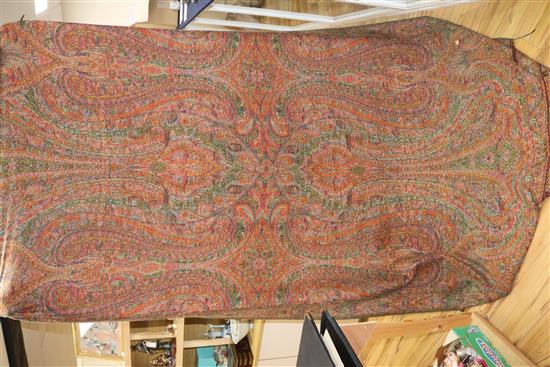 A 19th century Paisley shawl, another small shawl and a block printed Indian cotton cover